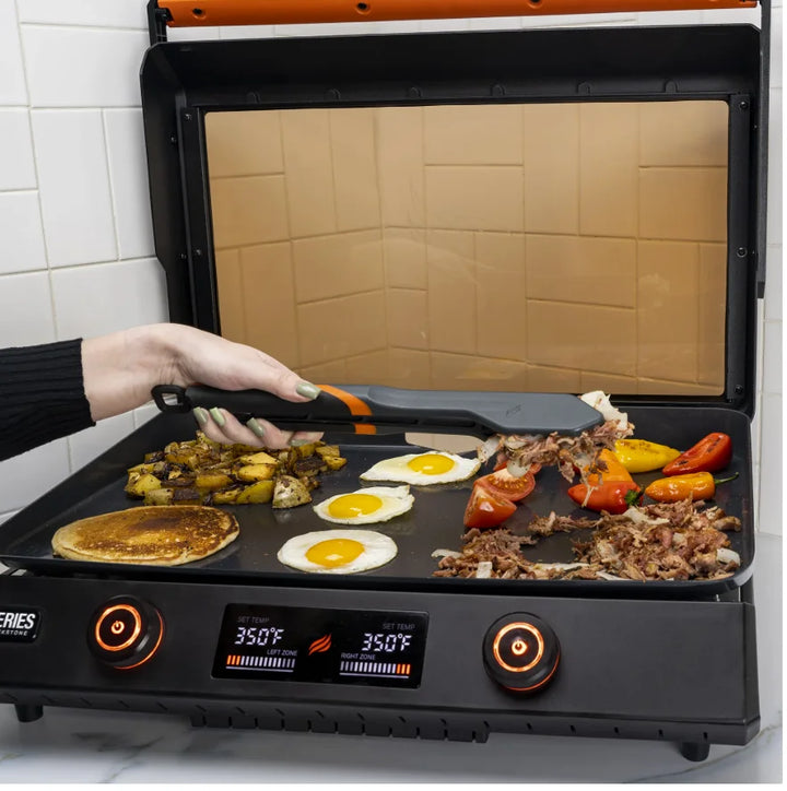 Blackstone E-Series Griddle Accessories Kit (4 Pieces) - Complete 4-piece toolkit for E-Series griddle surfaces, including two spatulas, scraper, and tongs made from heat-resistant nylon for easy use and dishwasher safe cleaning.