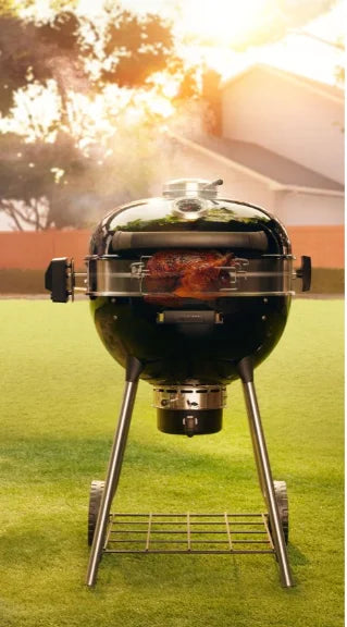 Napoleon Professional 22" Charcoal Kettle: Premium charcoal grill featuring porcelain-coated cast iron WAVE cooking grids, Vortex Heat Management System, stainless steel extension ring, and ACCU-PROBE temperature gauge for precise control over BBQ temperatures.