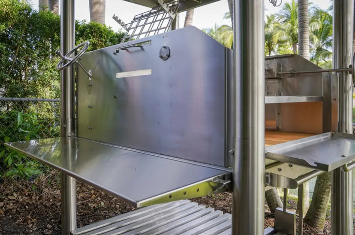 Tagwood's "The Beast On Steroids" Santa Maria Style Grill - High-performance 304 stainless steel grill with 3,363 sq in total grilling area across six independent cooking zones and multiple surfaces for precision temperature control.