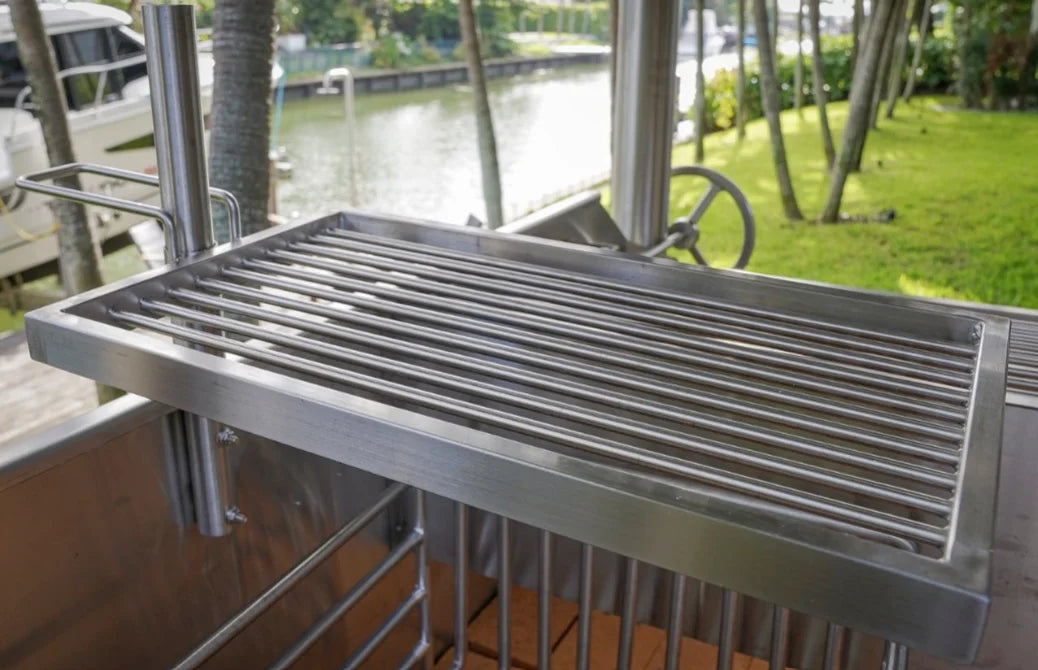 Tagwood "The Beast On Steroids" Santa Maria Style Grill - 304 Stainless Steel features all-304 stainless steel construction for superior durability, massive 3,363 sq. in. total grilling area across multiple cooking zones and six grilling surfaces including main grate, secondary grate, griddle, warming racks, clamp grill and meat hooks.