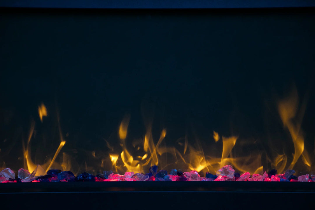 Amantii Panorama BI Extra Slim Smart Electric Fireplace features sleek black steel surround and clear decorative media, emitting vibrant flames in various colors, perfect for indoor or outdoor built-in installations.