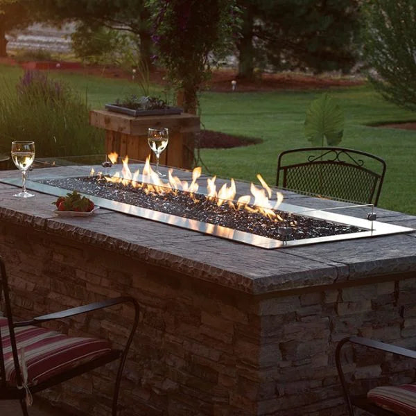 The Carol Rose Collection 48" LED Linear Outdoor Firepit features premium stainless steel construction, strong heating output (55,000 BTUs), and contemporary linear design.