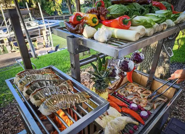 Tagwood Freestanding Santa Maria Style Grill - Robust 304 stainless steel grill with five cooking surfaces, including rotating clamp grill, for gaucho-style grilling and smoking.