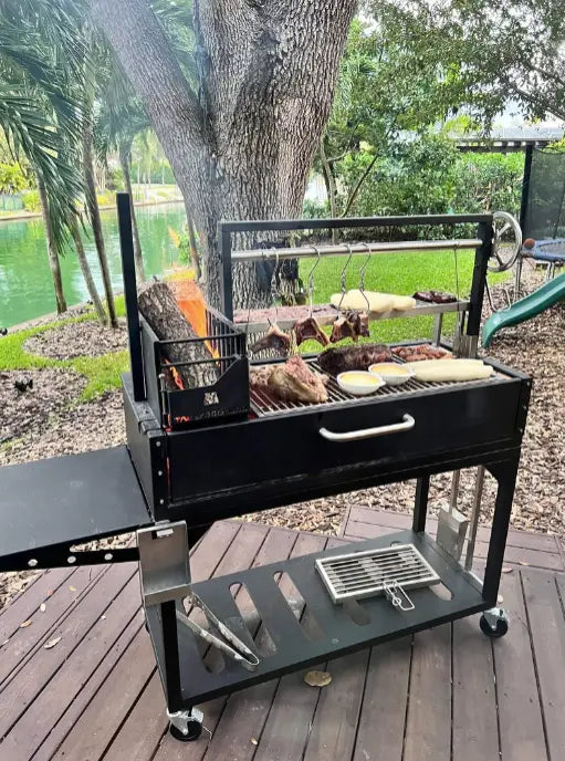 Tagwood "Chief Series" Freestanding Santa Maria Style Grill – Cold-Roll Steel & Stainless Steel, featuring 1/8” cold-rolled steel frame with premium 304 stainless steel food-contact surfaces and four cooking zones including main grate, secondary grate, griddle, and meat hooks.