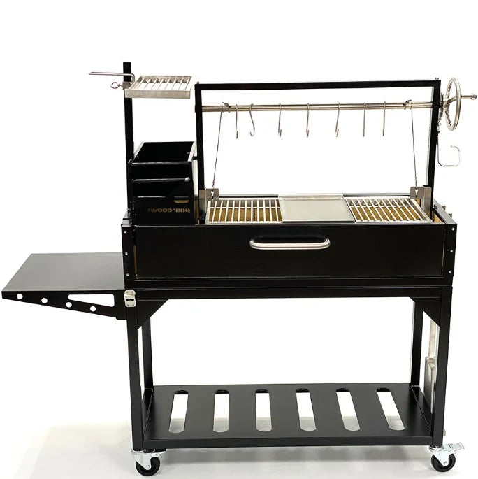 Tagwood "Chief Series" Freestanding Santa Maria Style Grill features cold-rolled steel body with black coating and 304 stainless steel grates, griddle, and meat hooks for authentic Argentine-style live-fire cooking, including firebox brasero, foldable side table, and heavy-duty casters.