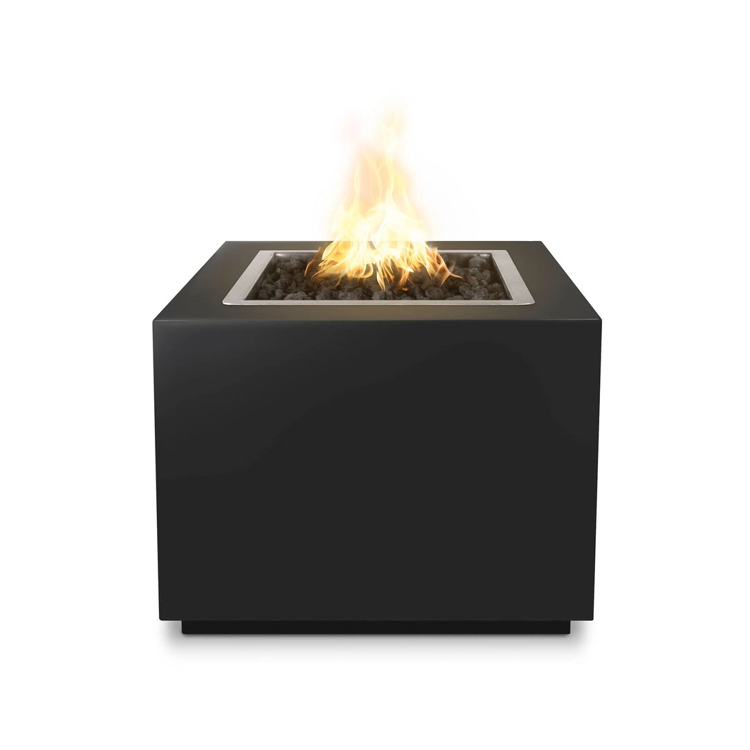 The Outdoor Plus Forma Fire Pit, a modern, handmade steel fire feature with stainless steel pan, burner, brass valve, and lava rock, perfect for outdoor spaces.