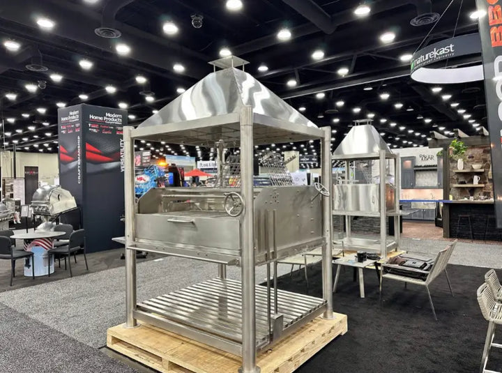 Tagwood 'The Silver Bullet XL' Santa Maria Style Grill - Stainless Steel, massive 304 stainless steel construction, dual clamp grills, 3,200 sq. in. total cooking area, professional-grade performance, ideal for large-scale entertaining and Argentine-style firewood grilling.