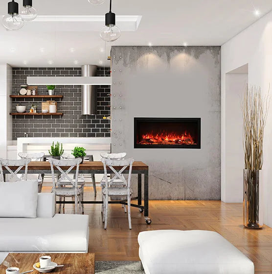 Amantii Symmetry XT Smart Electric Fireplace features WiFi-enabled connectivity, multi-function remote control, and ambient canopy lighting in 13 colors to illuminate decorative media, with a state-of-the-art flame presentation that can be changed from yellow to orange to red with the touch of a button.