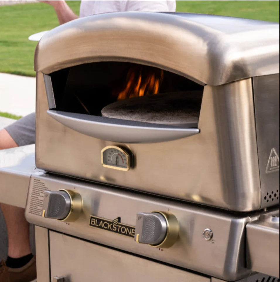Blackstone Select Pizza Oven, high-performance outdoor cooking unit featuring patented 2-Stone Technology and 65,000 BTUs for rapid pizza cooking in under 90 seconds.
