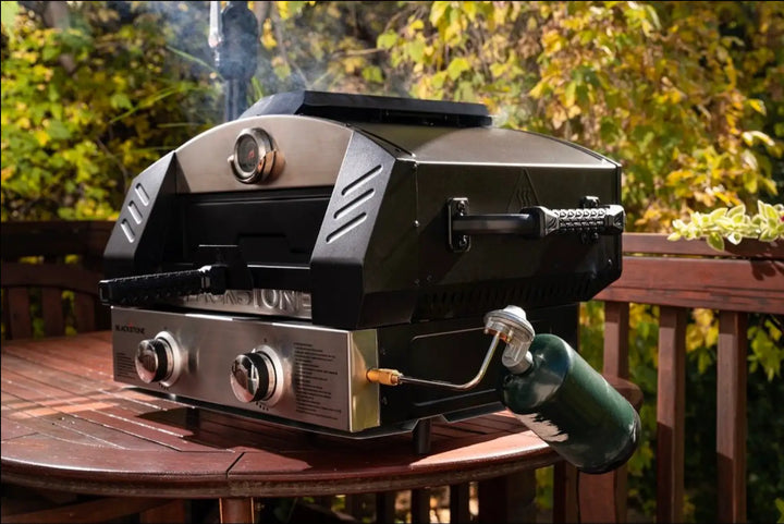 Blackstone Portable Pizza Oven Bundle features propane-powered cooking with patented 2-Stone Technology for even heat distribution and perfectly cooked pizzas up to 15 inches in diameter.