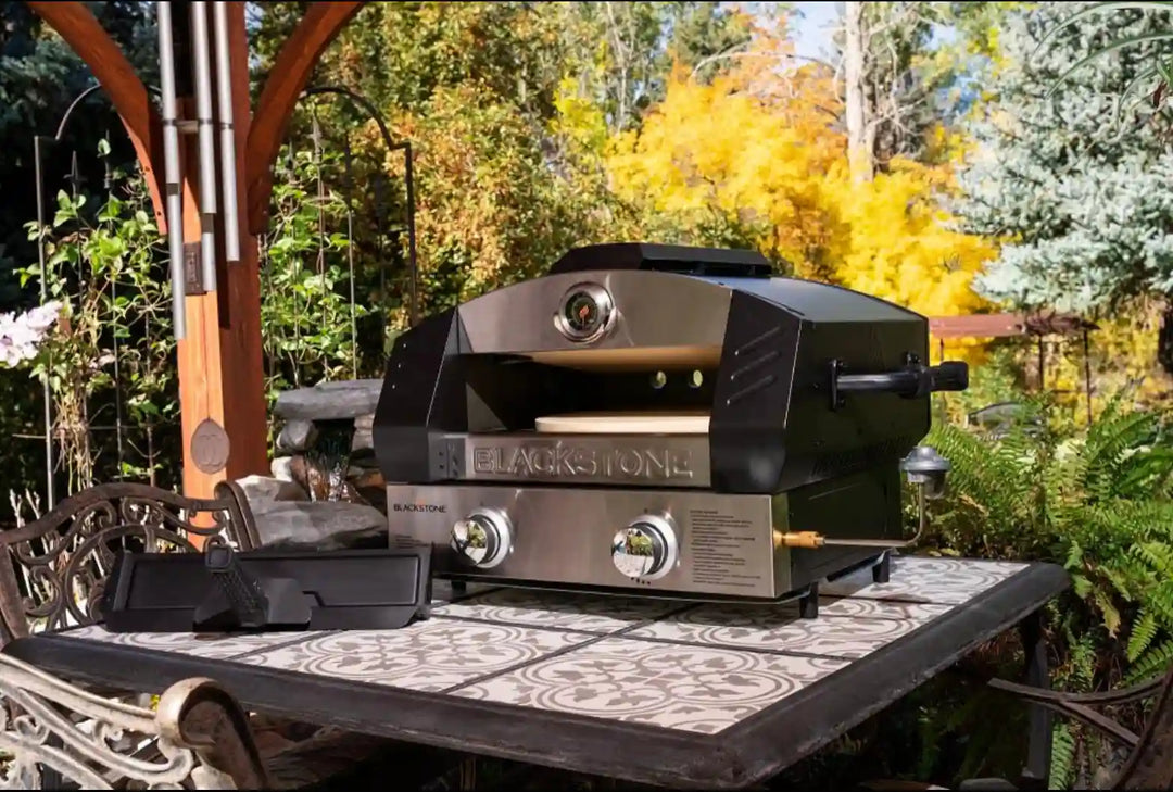 Blackstone Portable Pizza Oven Bundle - Propane-powered pizza oven features patented 2-Stone Technology for even heat distribution and perfectly cooked pizzas every time.