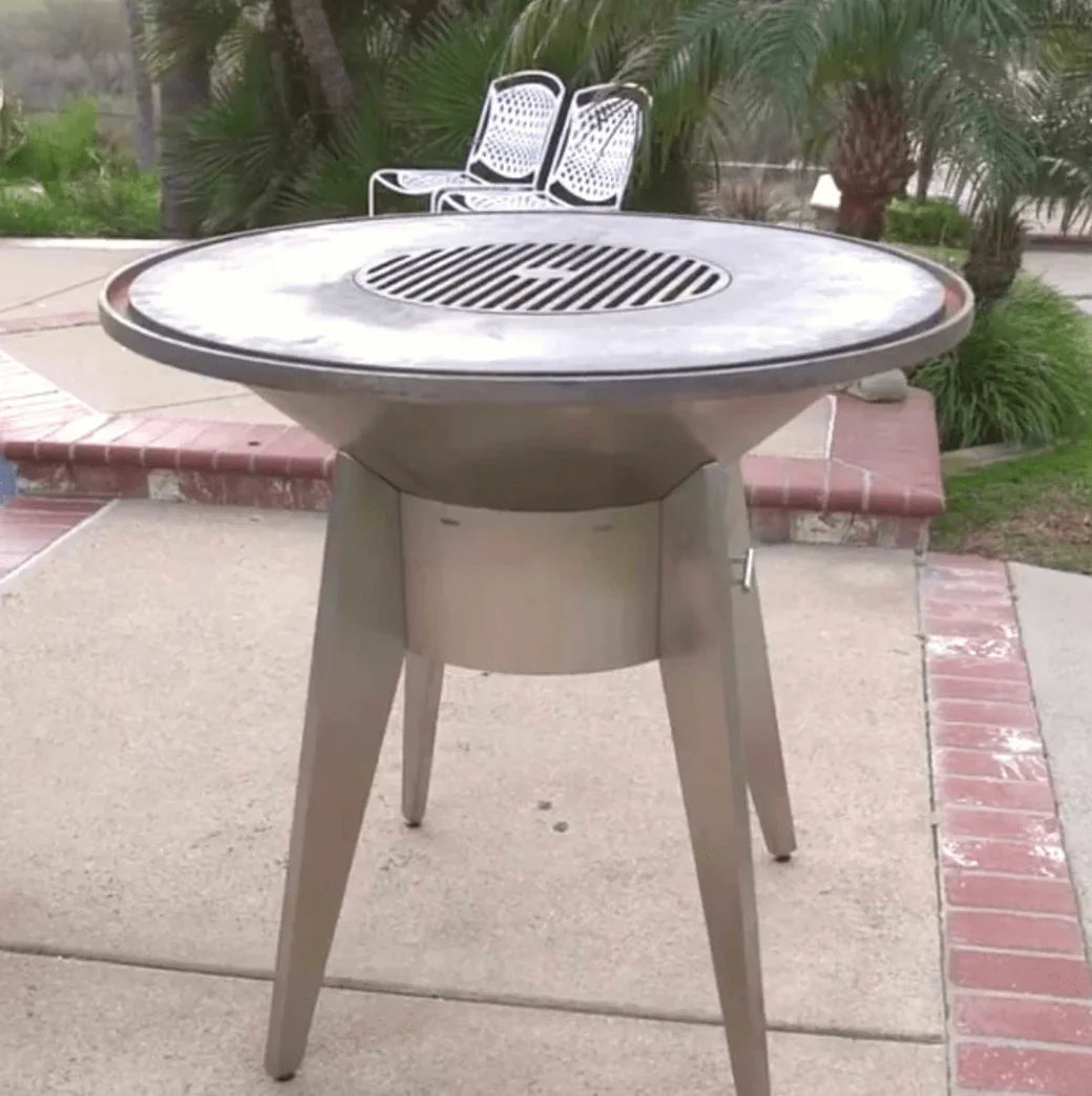 Videl USA Mojave Steel Fire Pit Grill, handcrafted in the USA, features a 40-inch cast iron cooktop for up to 50 burger patties and a removable fire pit option with three premium finishes.