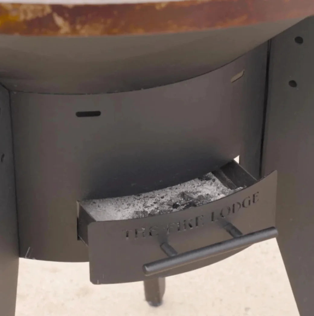 The Mojave Wood Burning Grill features a distinctive round cooking surface with central wood/charcoal orifice, three zones for high, medium, and low heat, and a 1" thick griddle plate for superior heat retention.
