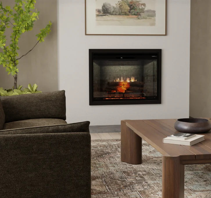 Dimplex Revillusion 36" Built-In Electric Firebox features ultra-realistic flames projected through a translucent Mirage panel, surrounded by a handcrafted Realogs ember bed and tumbled glass.