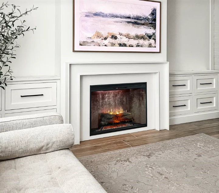 Dimplex Revillusion 36" Built-In Electric Firebox features Revulsion Flame Technology with ultra-realistic flames through Mirage panel, accompanied by hand-painted Realogs and a glowing ember bed with tumbled glass and black gravel.