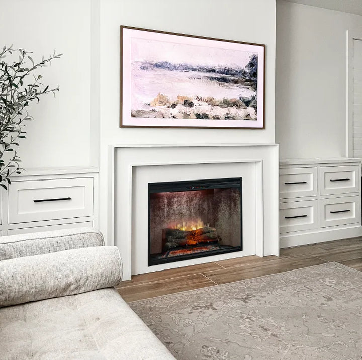 Dimplex Revillusion 24" Built-In Electric Firebox features handcrafted Realogs flames, adjustable brightness, and custom back panel finishes for realistic ambiance in residential or commercial spaces.