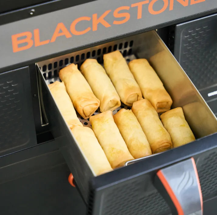 Blackstone Original 36" Griddle Air Fryer Combo features a 36” Omnivore Griddle Plate for fast heating and even heat distribution, paired with dual air fryers and a warming drawer for versatile cooking options.