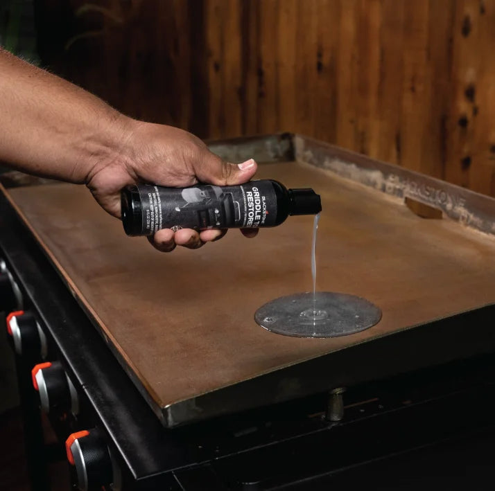 Blackstone Griddle Top Restoration Kit for restoring griddle surfaces to pristine condition with heavy-duty scrub pads and rust-removing restorer.