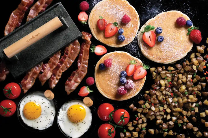 Blackstone Breakfast Kit - Complete breakfast set featuring pre-seasoned cast iron bacon press, batter dispenser holding up to 4 cups, and round egg rings for perfectly cooked eggs or mini pancakes.