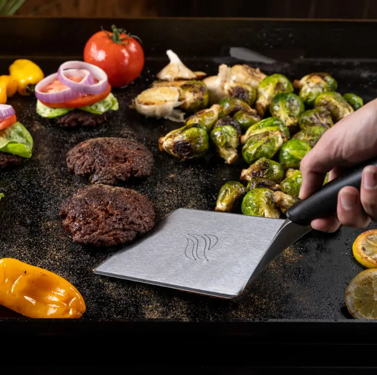Blackstone Smash Burger Kit (3 Pieces): A comprehensive griddle accessory set featuring stainless steel construction, including a hamburger spatula, basting dome, and burger press for crafting perfect smash burgers and more.