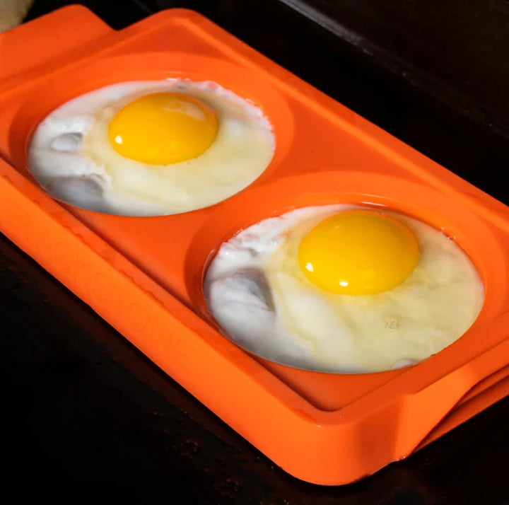 Blackstone Griddle Essentials Breakfast Kit (4 pc) features a round spatula, stir and pour batter mixer, crepe spreader, and 2-section egg ring tray for effortless breakfast preparation.