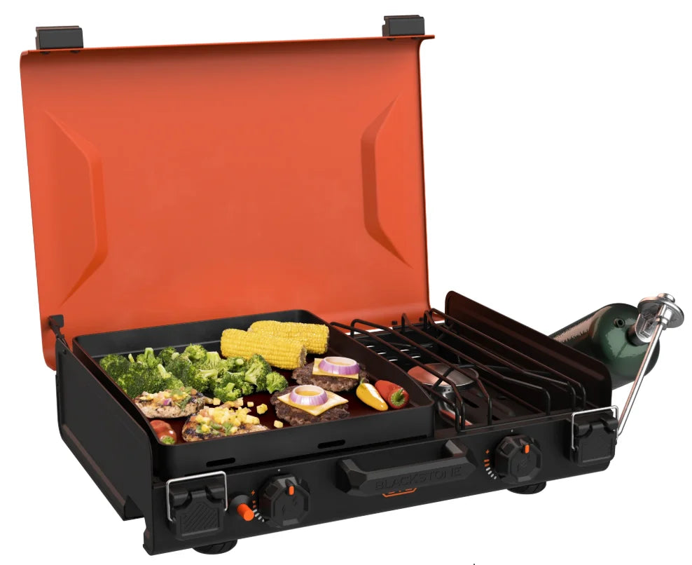 Blackstone 12x14" Camping Griddle and Side Burner features a compact briefcase-style design with latching hood, independent griddle and side burner controls, and non-stick coating for easy cleaning and low-mess cooking.
