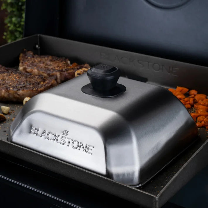 Blackstone Medium Square Basting Cover, 10” x 10” metal dome for optimal heat and moisture retention during griddle cooking, featuring a heat-resistant handle and dishwasher-safe design.
