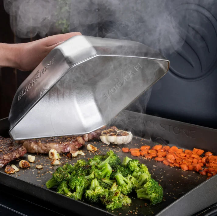 Blackstone Medium Square Basting Cover: 10" x 10" metal dome with heat-resistant handle for optimal griddle cooking performance, ideal for melting cheese or steaming vegetables.