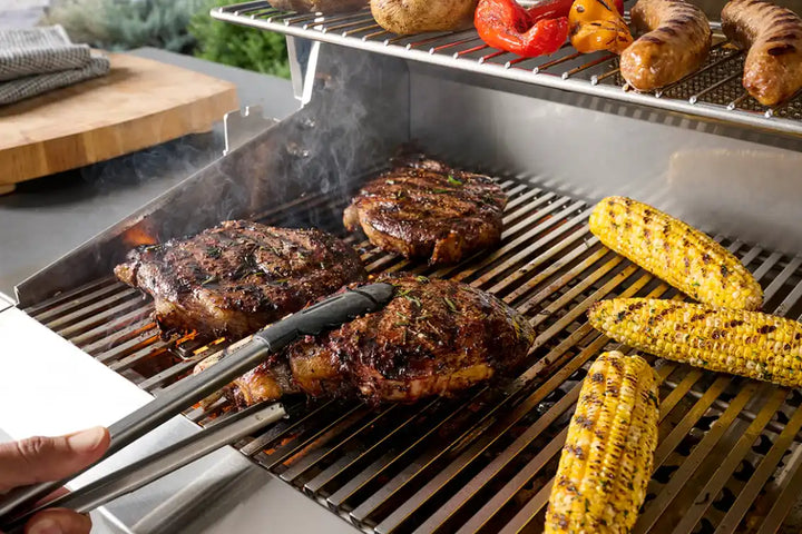 The American Outdoor Grill 24" T-Series Built-In Grill features a Flame Thrower piezo ignition system, analog thermometer, and diamond-shaped cooking grids for optimal heat transfer in a compact, gas-powered outdoor kitchen design.