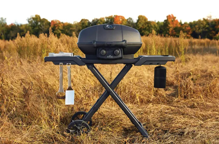 Napoleon Phantom TravelQ PRO 285 Portable Gas Grill with Scissor Cart: Sleek matte black finish wraps entire grill from lid to cart, featuring high-top lid, two stainless steel burners, and removable warming rack for versatile cooking and maximum portability.