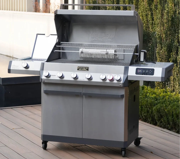 Monument Grills Eminence Series E605 Gas Grill featuring stainless steel construction, infrared rear and side sear stations, full Blaze Zone cooking system, 640+ sq. in. of cooking surface, and 89,000 BTUs of total output for professional-grade heat control and sleek design.