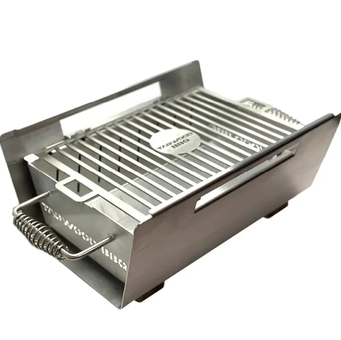 Tagwood Table Top Warming Brazier made from 304 stainless steel and acacia wood, featuring a 121 sq. in. warming surface for serving hot dishes at the table, including two skewers for versatile use.