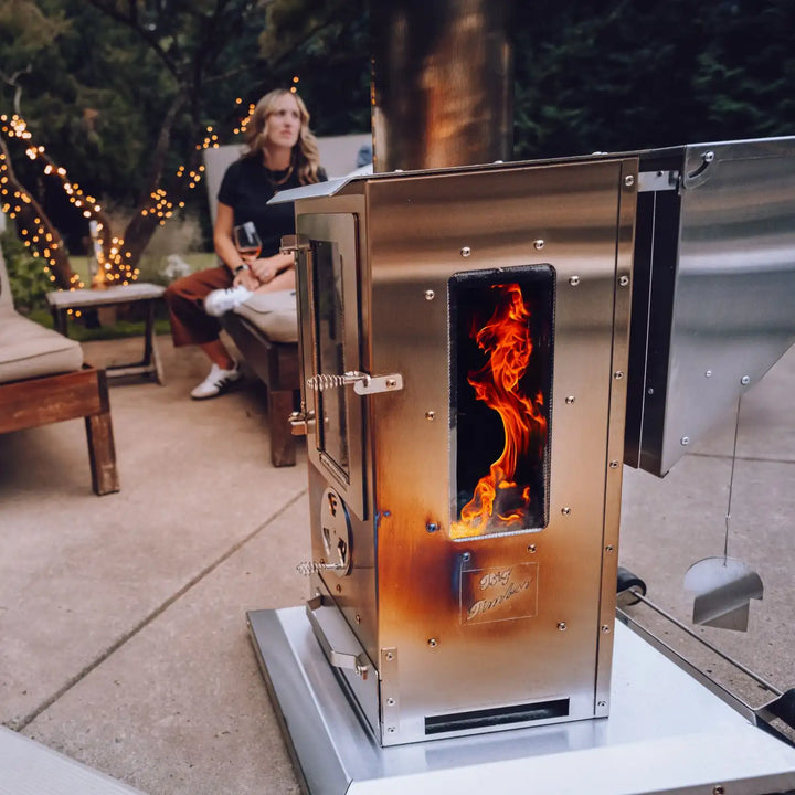 Big Timber Outdoor Fireplace with Elite Safety Cage: A high-performance, freestanding heater delivering 90,000 BTUs of radiant warmth, featuring an oversized viewing window and virtually smokeless operation.