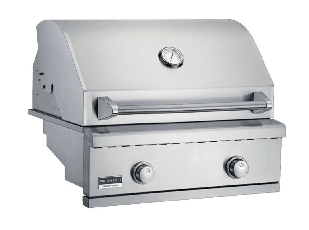 Broilmaster B-Series 25-Inch Stainless Steel Built-In Gas Grill, featuring three 14,000 BTU cast stainless steel burners for a total of 27,000 BTUs, with a welded double-lined lid and heat zone dividers for versatile cooking zones.