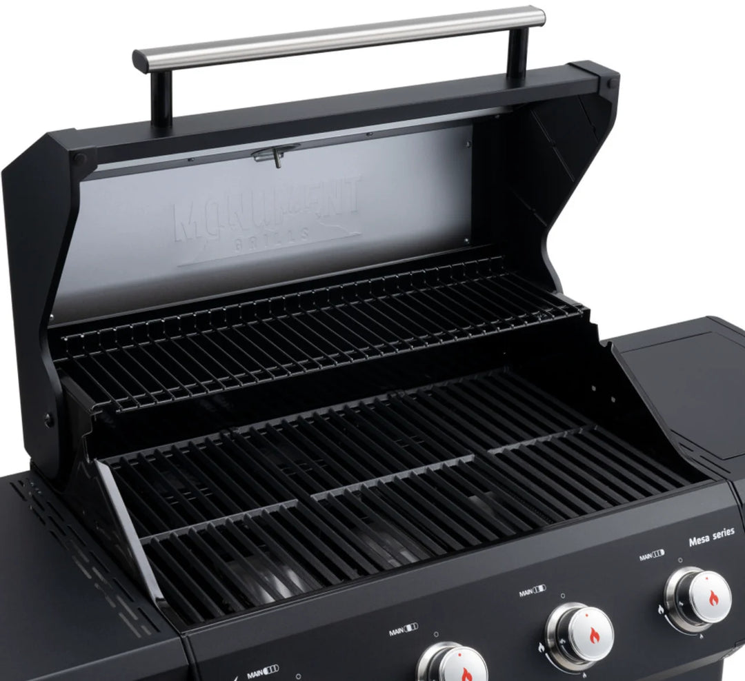 Monument Grills Mesa Series M425 4-Burner Gas Grill featuring ClearView lid, stainless steel burners, side burner, black powder-coated finish, porcelain-coated cast iron grates, and 52,000 BTUs of total heat output.