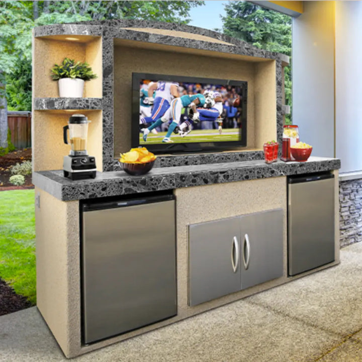Cal Flame 'Paradise' Outdoor Entertainment Center features a large TV opening, dual refrigerators for cold storage, under counter lights, and spacious shelving for outdoor essentials in Ameristone Stucco with 12x24 tile accents.