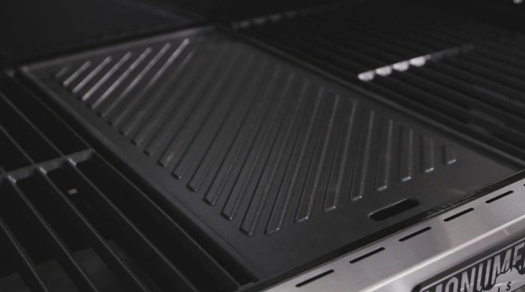 Monument Grills Cast Iron Cooking Plate, porcelain-coated cast iron construction for even heat distribution and non-stick finish, ideal for searing meats, frying vegetables, or preparing breakfast dishes on multiple Monument grill models.