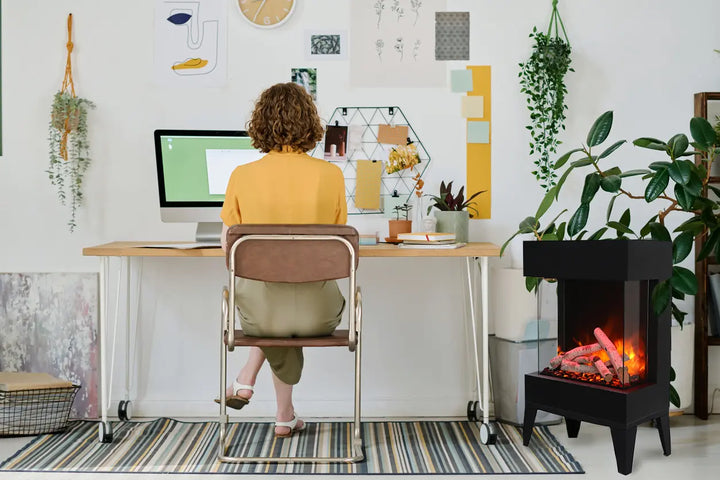 Amantii Cube 2025WM Freestand Electric Fireplace features vibrant multi-colored flames, 3-sided glass viewing area, ambient canopy lighting in 13 colors, and customizable media options.