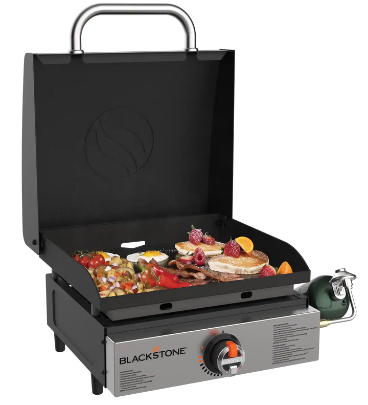 Blackstone Original 17” Blackout Omnivore Tabletop Stainless Steel Griddle with Built-in Hood, featuring advanced Omnivore Plate Technology for fast heat-up and consistent cooking temperatures.
