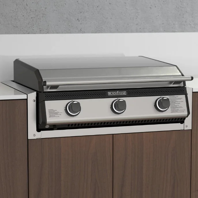 Blackstone 28" Drop-in Griddle Insulating Jacket for outdoor kitchens, protects combustible enclosures from heat damage, constructed from durable 304 stainless steel with integrated water drainage system and utility routing port.