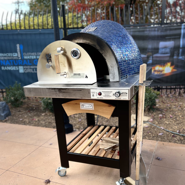 HPC Fire Forno Series Pizza Oven - Handcrafted hybrid oven with glass mosaic tile, stainless steel hearth, and wheeled cart for portable outdoor cooking.
