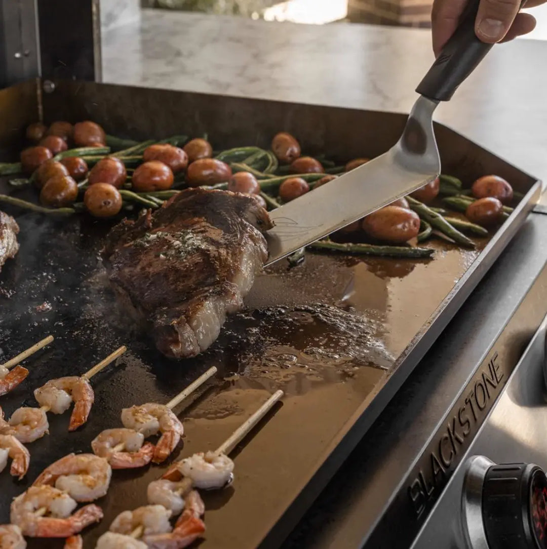 Blackstone 30” Electric Drop-In Griddle: A professional-grade griddle featuring a 30" Omnivore Plate with three independently controlled heat zones for precise temperature control, digital readouts, and rear grease management drawer for easy cleaning.