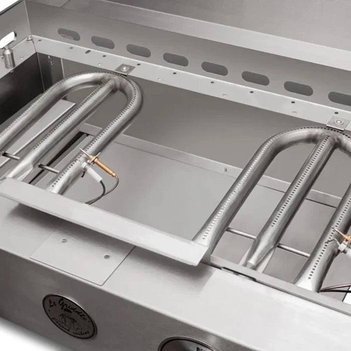 The "Grand Texan" Freestanding 60" Griddle by Le Griddle features dual expansive griddle plates atop a sleek 304 stainless steel cart with fold-down side shelves and four U-shaped burners producing 36,000 BTUs of cooking power.
