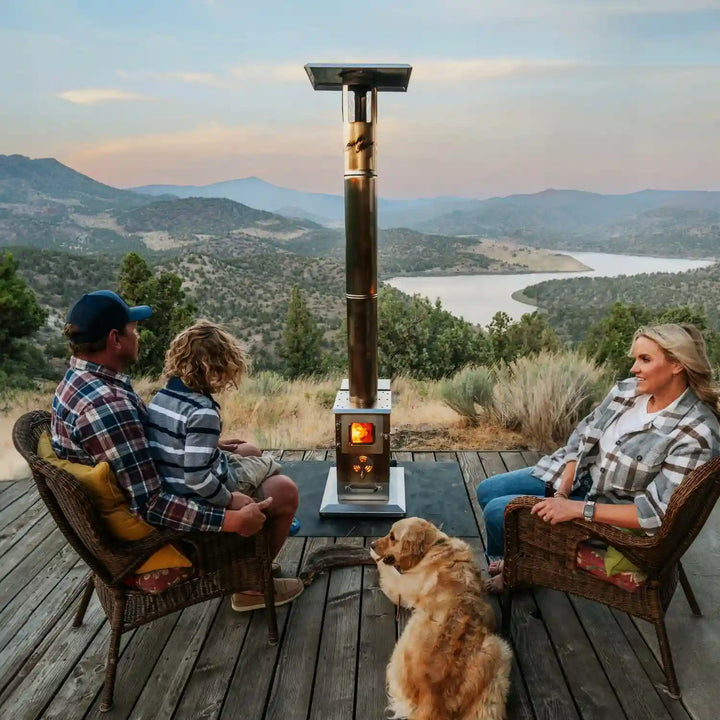 Close-up view of Lil' Timber Outdoor Fireplace with Elite Safety Cage, showcasing its stainless steel construction, tempered glass viewing windows, and rugged design, highlighting the product's durability and heat output.
