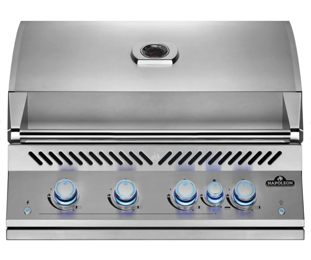 Napoleon Built-In 700 Series 32" Gas Grill with all-stainless steel construction, featuring four main burners producing 66,000 BTUs and a rear infrared rotisserie burner, complete with commercial-grade rotisserie kit and angular grease management system.
