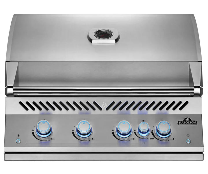 Napoleon Built-In 700 Series 32" Gas Grill with all-stainless steel construction, featuring four main burners producing 66,000 BTUs and a rear infrared rotisserie burner, complete with commercial-grade rotisserie kit and angular grease management system.