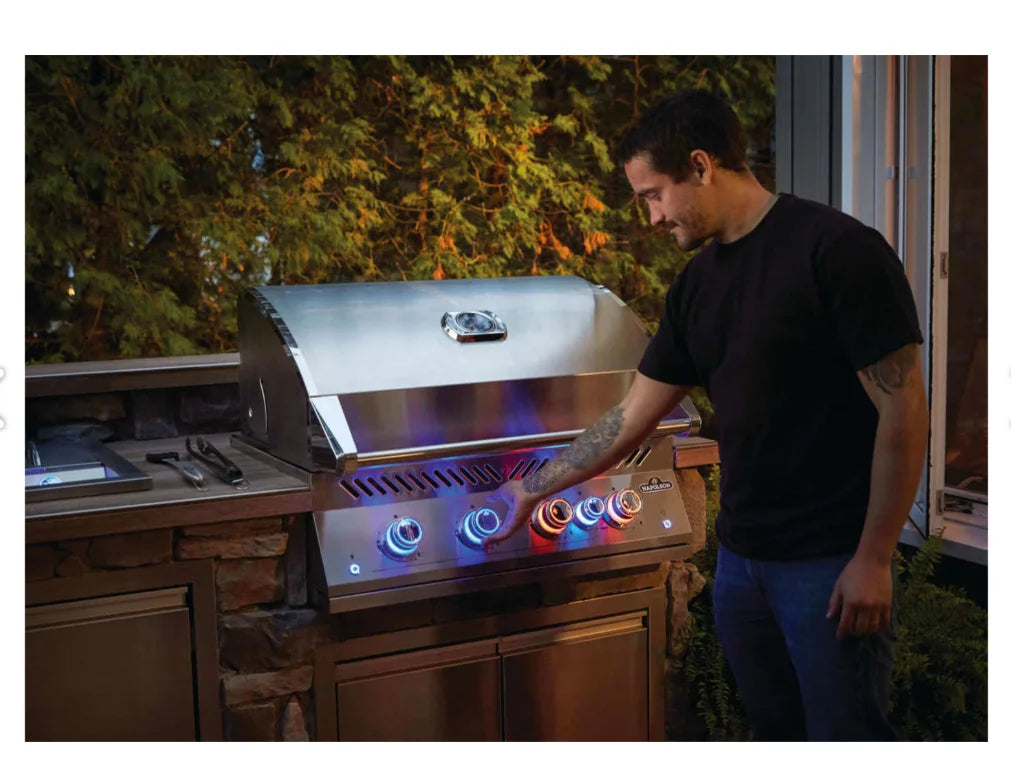 Napoleon Built-In 700 Series 32-inch Gas Grill with Rear Infrared Burner - Stainless Steel" features all-stainless steel construction, four stainless steel main burners producing 66,000 BTUs, and a rear infrared rotisserie burner for even heat distribution and superior searing.