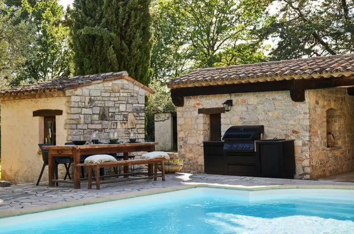 OASIS 301 Modular Outdoor Kitchen Island with Built-In 700 Series 32" Gas Grill: Durable matte black galvanneal steel island paired with powerful 78,000 BTU gas grill featuring four stainless steel burners and rear infrared rotisserie burner, with soft-close doors and drawers.