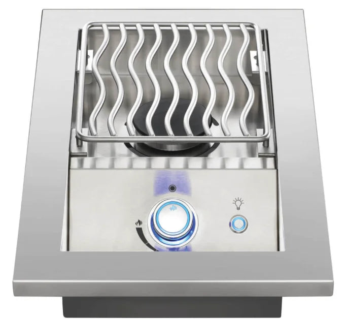 Napoleon Built-In 700 Series Single Range Top Burner with Stainless Steel Cover: Close-up image of premium stainless steel built-in range top burner with backlit SafetyGlow control knob and JETFIRE ignition system, ideal for outdoor kitchens with 10,000 BTUs of controlled heat.