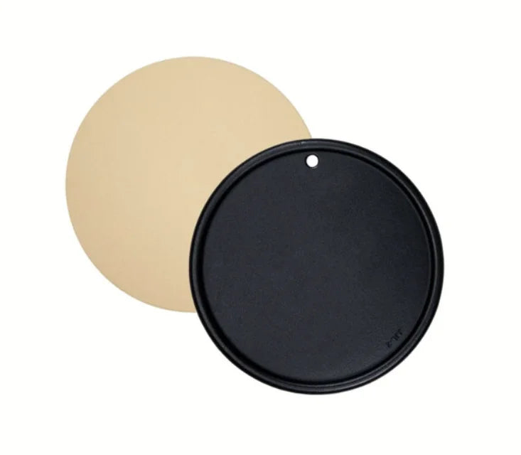 Monument Grills Cordierite Pizza Stone & Round Reversible Cooking Plate - A dual-purpose cooking accessory featuring a cordierite pizza stone for authentic brick-oven results and a porcelain-coated cast iron plate with reversible surfaces for grilling and searing a variety of foods.